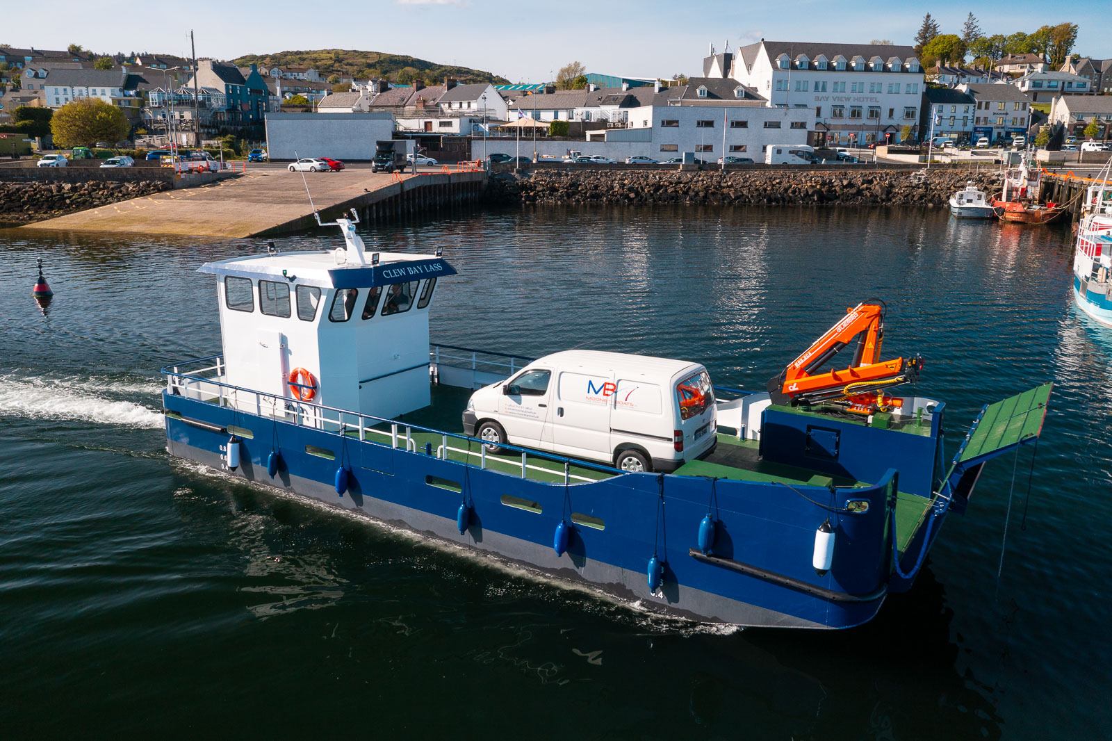 Commercial workboat built by Mooney Boats operating on the water